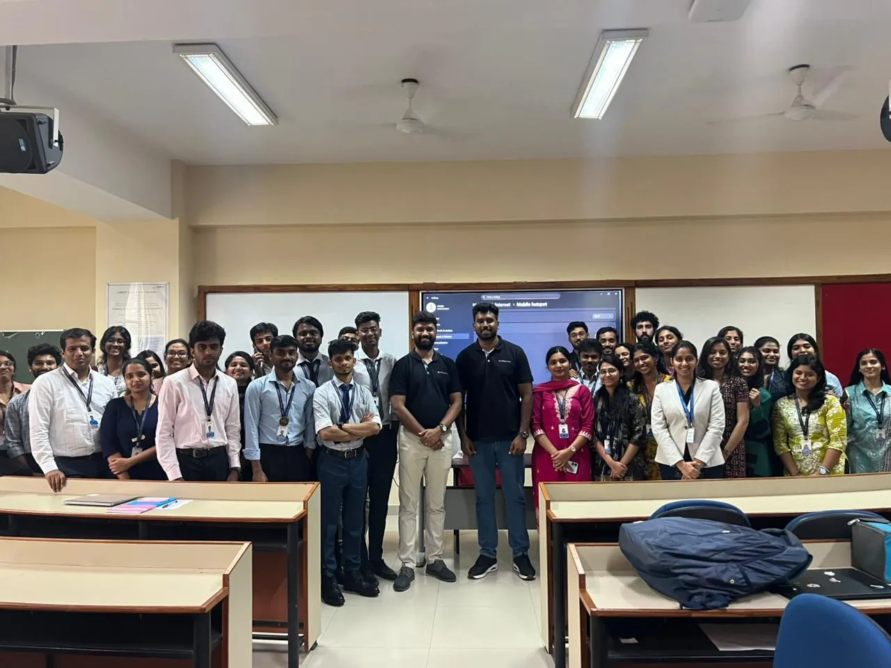 Students and staff photographed with the Spharaka team at the front of a Christ University lecture room after a cybersecurity awareness session.